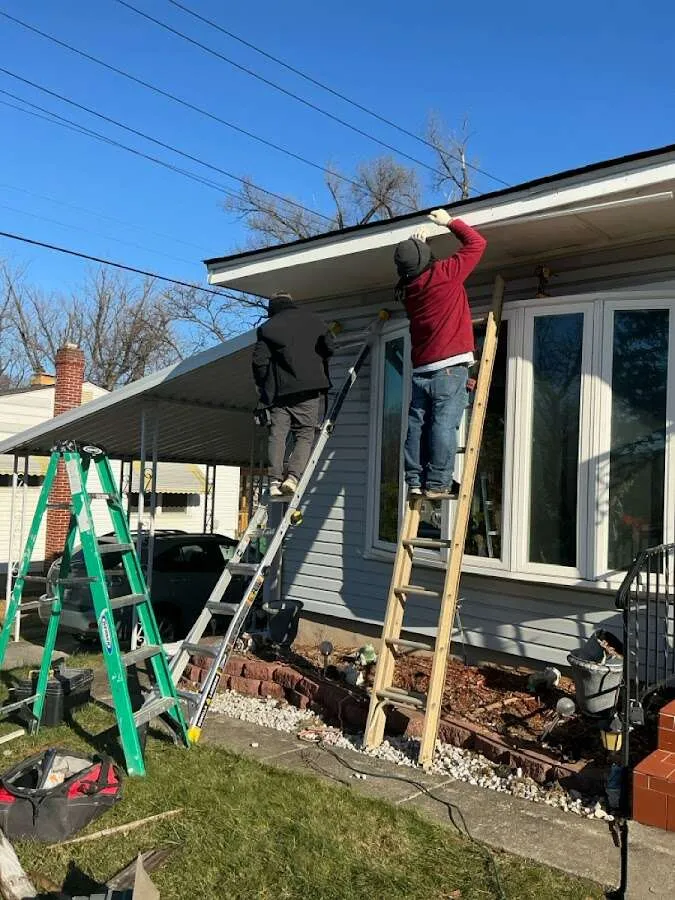 Restoration crew performing exterior repair in Bastrop